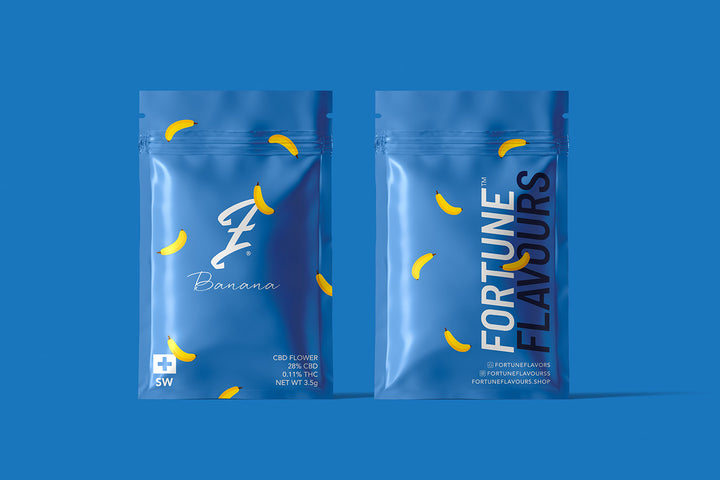 Two packages of Banana Kush CBD flower by FortuneFlavours, with light blue branding on a blue background