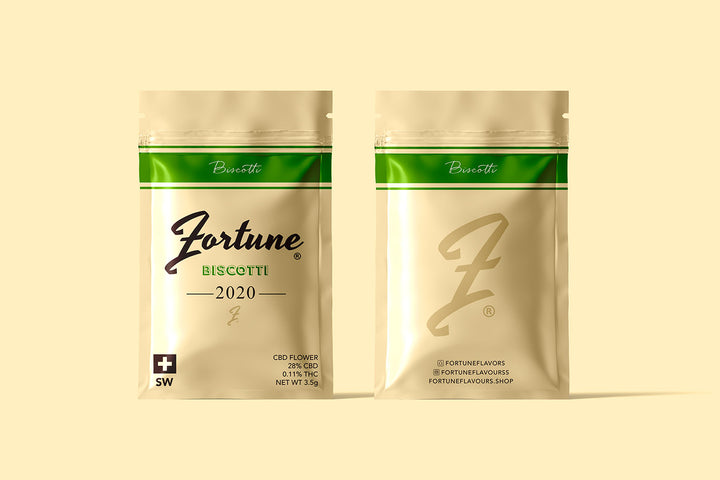 Two packages of Biscotti CBD flower by FortuneFlavours, with sand colour branding on a cream background