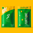 Laden Sie das Bild in den Galerie-Viewer, Two packages of Lemon Haze CBD flower by FortuneFlavours, with bright green branding on a yellow background
