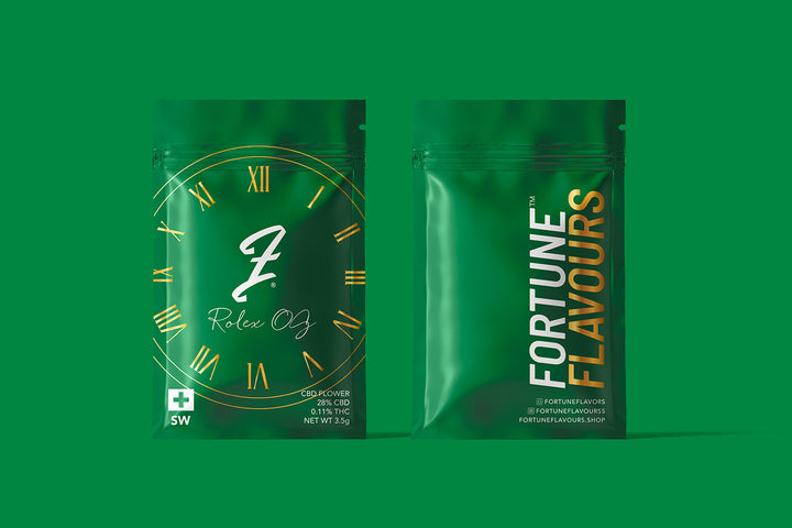 Two packages of Role OG CBD flower by FortuneFlavours, with forest green branding on a green background